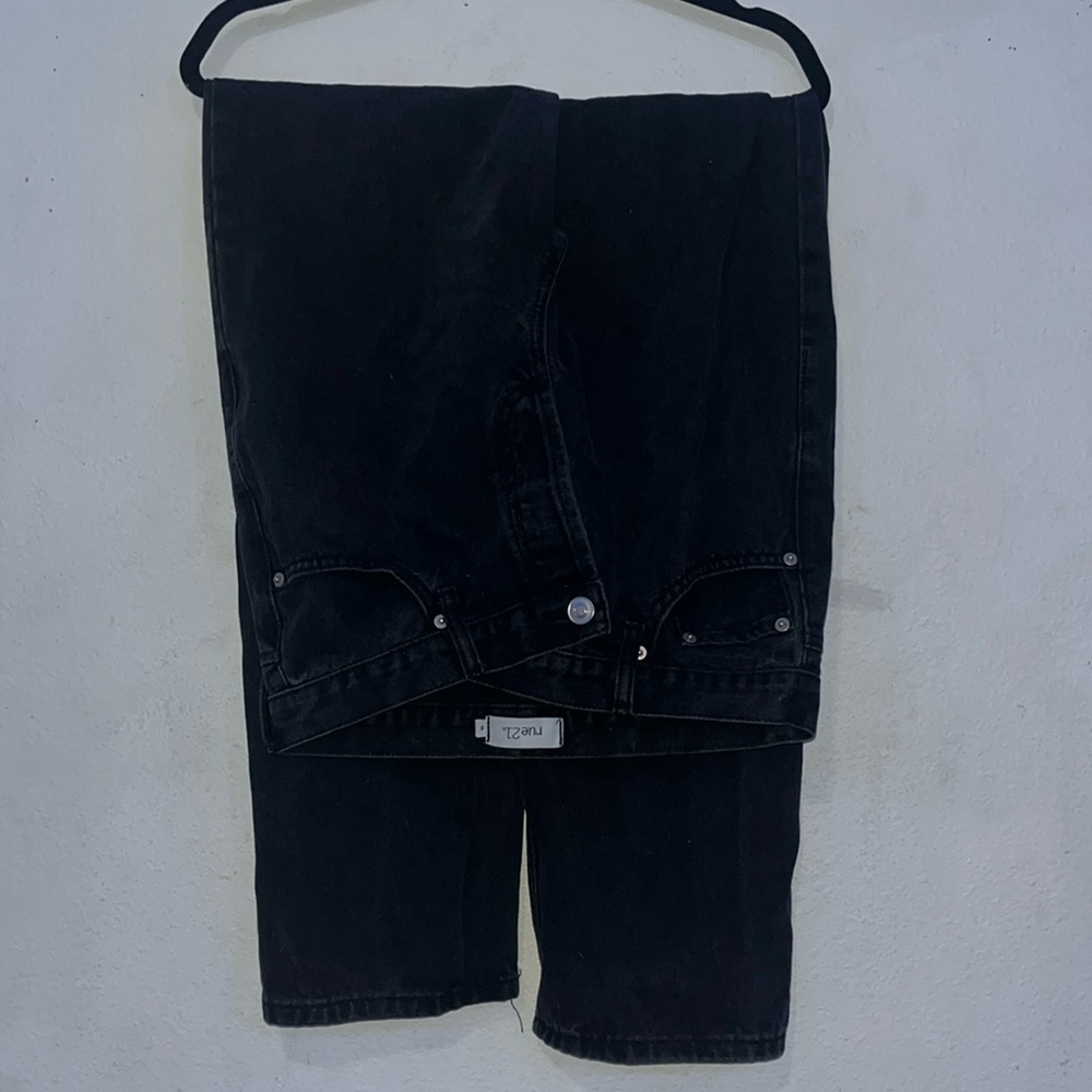 Black asymmetrical jeans